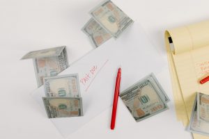 money red pencil and note paper