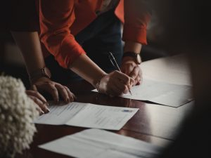 woman signs document